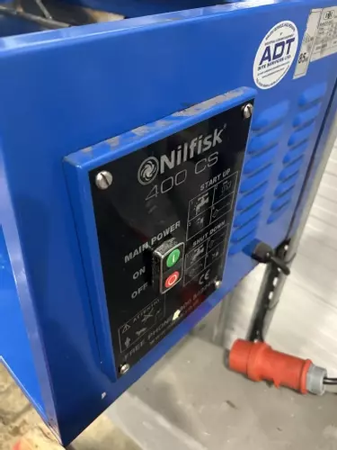 Control panel on a Nilfisk DTE wall-mounted static pressure washer before contactor and overload replacement repair.